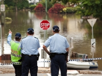 Police were stationed at the edge of the floodwaters to keep onlookers and residents from crossing in dangerous areas.