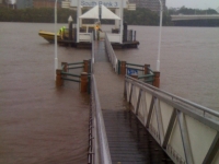Water rises over a ferry pontoon
